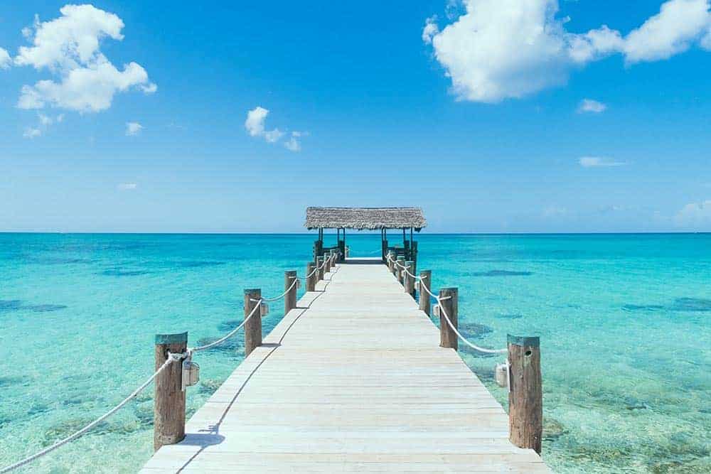 Time for Rest and Relaxation - pier on tropical beach