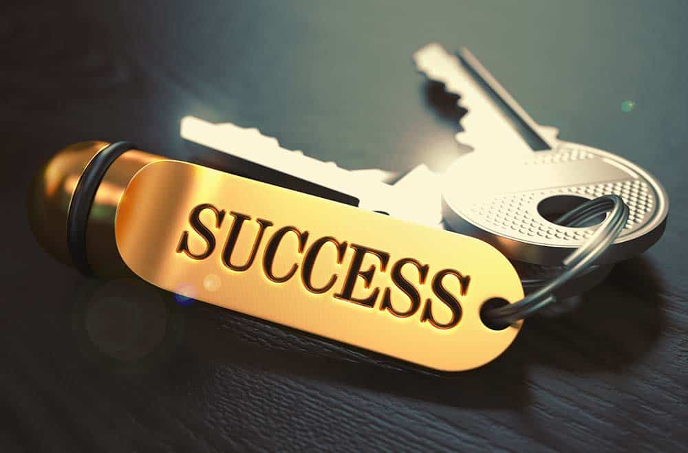 Keys with a golden success keychain